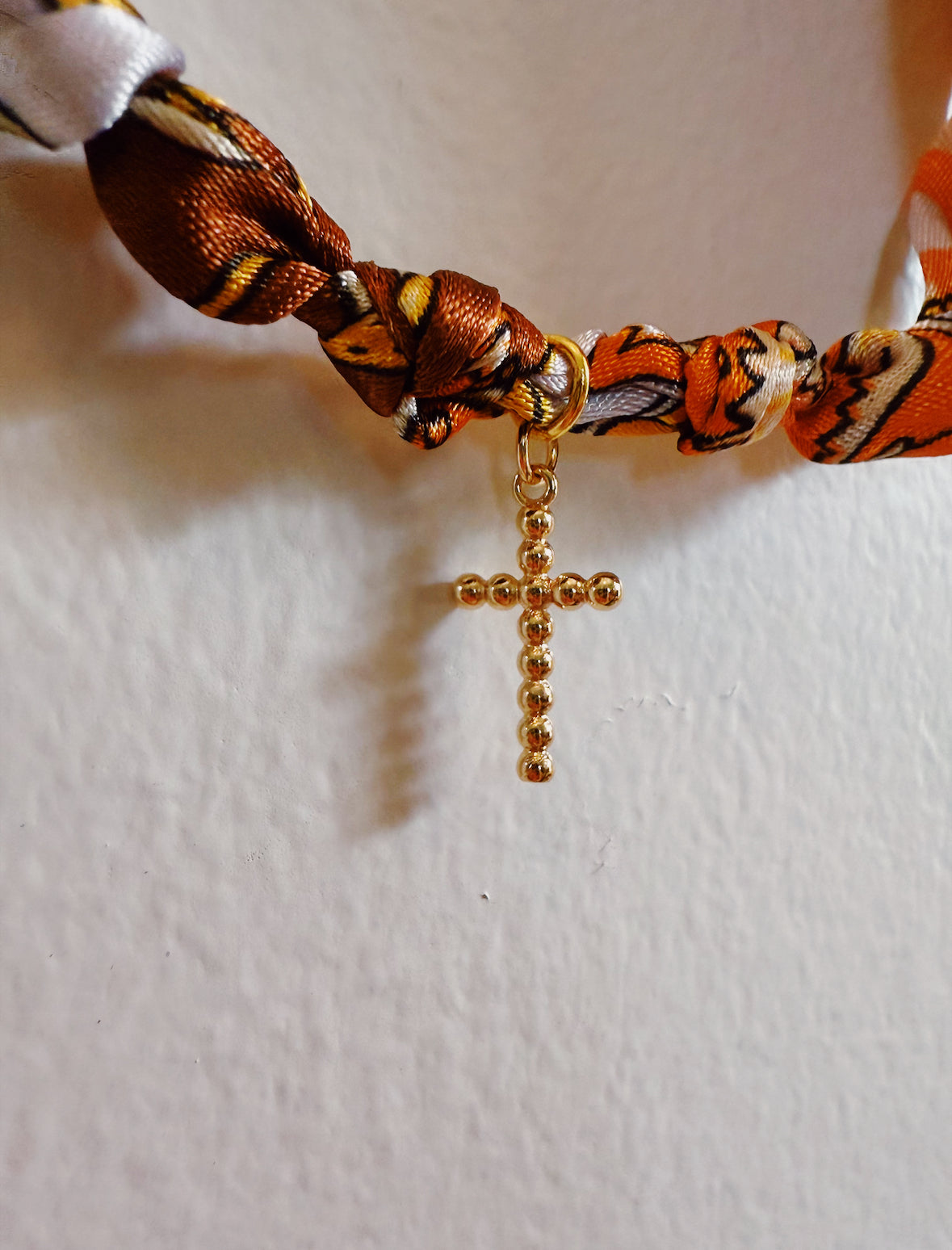 Crossing Orange Charm Knot